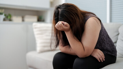Stressful Asian overweight woman sad of dieting Weight loss fail..