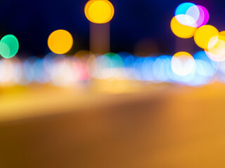 Blurry night scene, colourful light cones, traffic light / abstract background webdesign