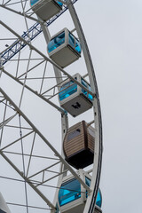 Helsinki city ferris wheel on a cloudy day. Blue cabins and a sauna type.