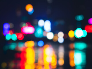 Blurry night scene, colourful light cones, traffic light / abstract background webdesign