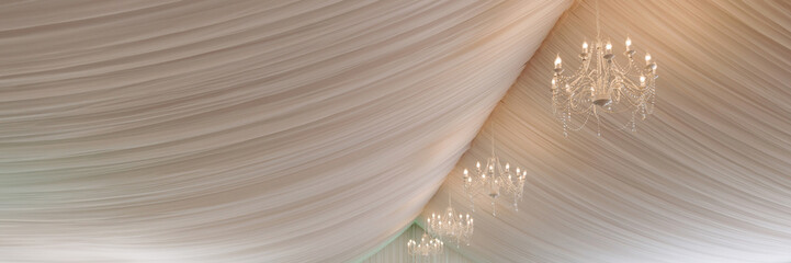 A view inside a marquee set up for a wedding reception.Banner with copy space.