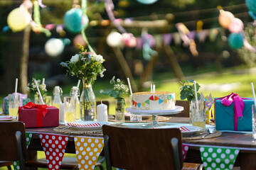 Shot of the birthday table with colorful decorations, birthday cake, and gifts. Inspiration for...