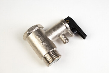 water valves, used inboiler water systems. Shiny metal, shiny texture on white background. Bathroom. Top view.