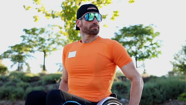 With his racing wheelchair, the middle-aged Caucasian athlete showcases incredible skill and determination as he strives for Paraolympic glory