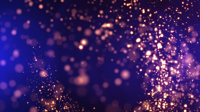 Abstract shiny golden particles flowing on gorgeous blue gradient background. Sparkling particles seamlessly moving with soft light and bokeh effect. Holidays, celebration, Christmas and events. 4k.	
