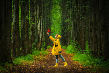 Obraz premium Woman in yellow raincoat