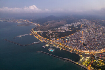 Aerial city center and port at night. Samsun, Turkey