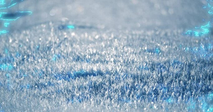 In a striking close-up macro view, a snow hill unfolds as a complex mosaic of countless tiny crystals, each glowing with iridescent light at its brightest points.