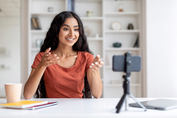 Enthusiastic Young Indian Woman Blogger Broadcasting from Home Space