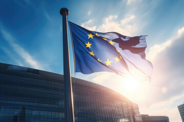 EU flag waving in front of modern building with sunshine - obrazy, fototapety, plakaty
