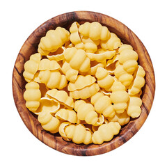 Pasta conchigliei noodle in wooden bowl isolated on white, close up