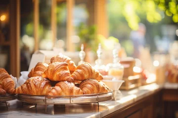 Fotobehang Small cozy cafe coffee shop bakery completing order business interior sunny morning light barista offers cheap hot tasty cocoa latte cappuccino americano espresso baguette bread bun donuts croissants © Yuliia