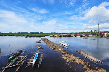 Fototapeta na wymiar Traditional fishing boats harbour at Siargao, Philippines.