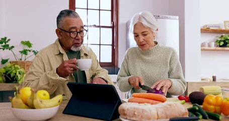 Cooking, speaking or old couple with tablet or food for a healthy vegan diet together in retirement at home. Online, interracial or senior woman in kitchen talking to an elderly man for dinner recipe - Powered by Adobe