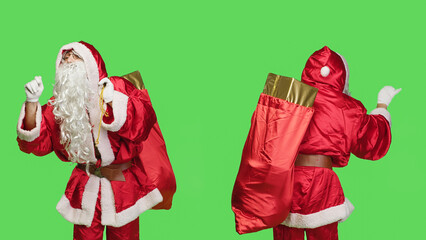 Saint nick bandmaster chief in costume accompany professional orchestra as choir musician, standing over greenscreen. Santa claus with gifts bag playing band music, musical conductor.