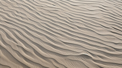 Obraz premium Closeup of rippled sand on a windswept beach, revealing its rough and textured appearance.