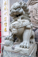 Fototapeta na wymiar stone lion statue in front of a temple