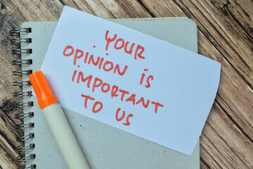 Concept of Your Opinion is Important To Us write on sticky notes isolated on Wooden Table.