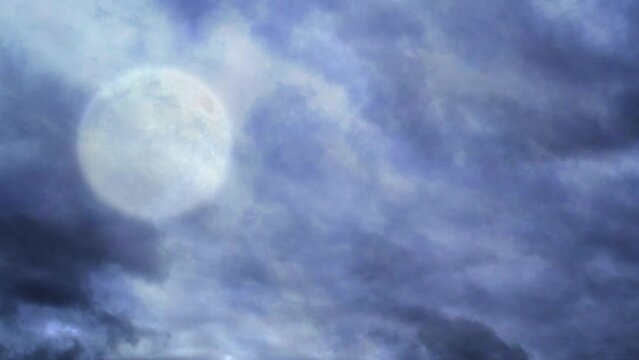 Full Wolf Moon Cloud Crawl 4K Loop features a white full moon in the sky with clouds passing by in a loop.