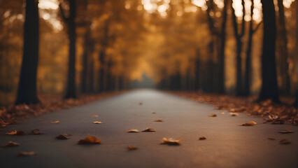 Autumn road with yellow fallen leaves in the forest. Selective focus.