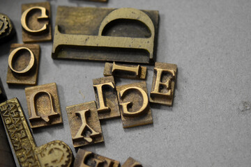 Antique printing press letters close-up metallic color Czech language