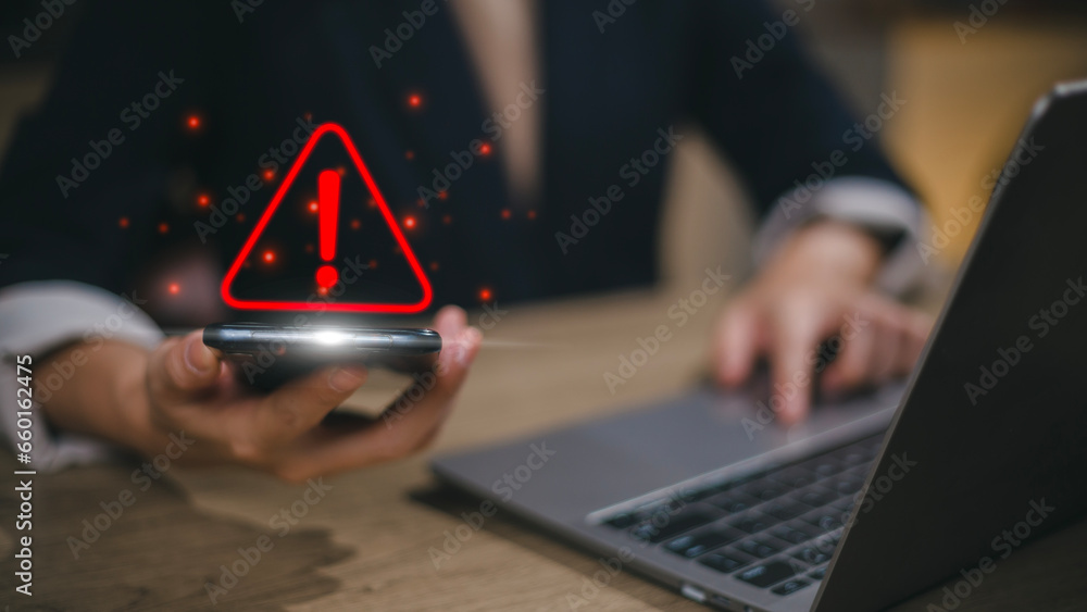Aufkleber businesswomen or users, programmers, and developers use smartphones with triangle caution warning si
