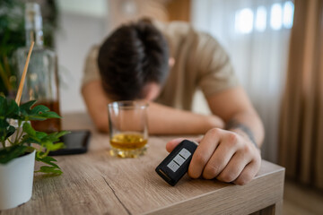 one man sit at home with bottle of liquor drink whiskey drunk alcoholic Alcohol abuse, addiction...