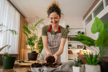 woman gardener florist take care grow cultivate plants at home