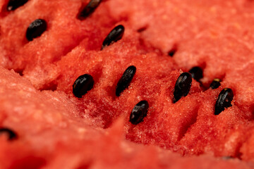 a large number of black seeds in a red ripe watermelon