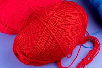 woolen threads of red color for knitting knitting close-up