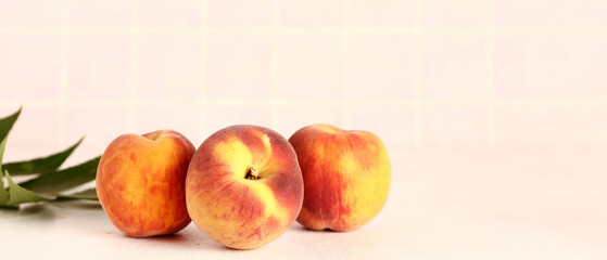 Sweet peaches on light background