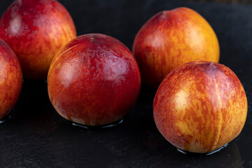 ripe delicious and fresh peaches of a red hue