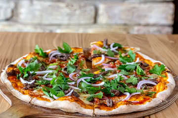 delicious steak pizza with beef and onions
