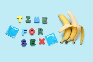 Text TIME FOR SEX with condoms and bananas on blue background