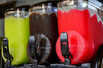 Summer food, cold icy frozen granita slushy making machines in street cafe, tasty drink