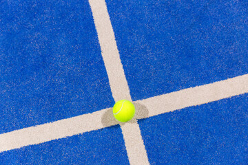 Fototapeta na wymiar padel ball on a padel blue court 
