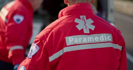 Paramedic team, patient and accident on stretcher, ambulance or injury for medical attention in street. First responder, healthcare expert and emergency on road for ems job, safety or transportation