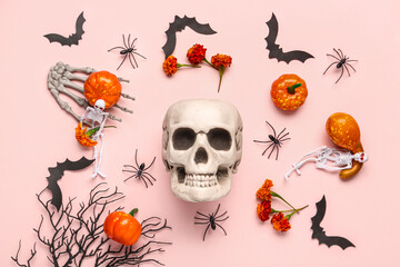 Composition with different Halloween decorations on pink background