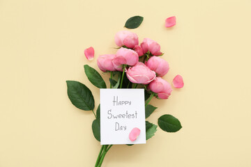 Fototapeta premium Greeting card with text HAPPY SWEETEST DAY and bouquet of rose flowers on yellow background. National Sweetest Day