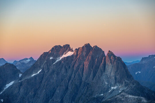 Sunrise Reaching Mountain peak © robert