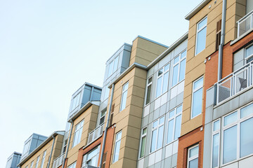 modern cityscape at dusk, featuring illuminated skyscrapers reflecting in calm waters, epitomizing urban progress and innovation