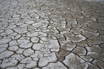 Cracked soil due to the long dry season. Rivers, lakes or ponds can dry and crack like this to form...