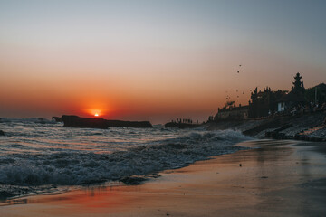 sunset in the Canggu beach,silhouette of bali temple