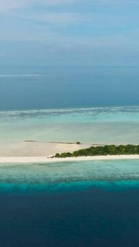 Top view of sandy tropical island with a beautiful beach surrounded by a coral reef.Timba Timba islet. Tun Sakaran Marine Park. Borneo, Sabah, Malaysia.