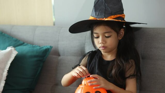 The children in demon costumes is spell enchant so enjoyment in halloween. .Halloween concept.
