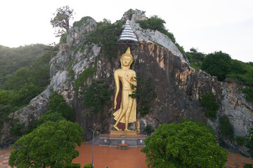 Phra Buddha Wichitman It is a large Buddha image, outdoors, which can be seen from the road passing by. Located at Tham Ruesi Khao Ngu Temple. Located at Ratchaburi Province in Thailand.