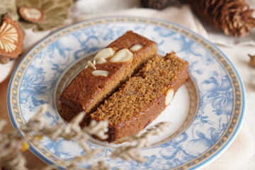 Decadent Black and Brown Brownies with a Generous Almond Topping - Irresistible Dessert Temptation
