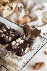 Decadent Black and Brown Brownies with a Generous Almond Topping - Irresistible Dessert Temptation