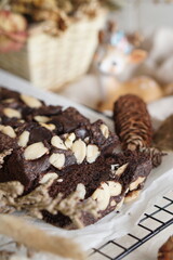 Decadent Black and Brown Brownies with a Generous Almond Topping - Irresistible Dessert Temptation