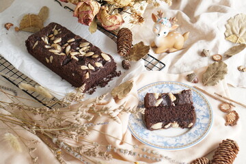 Decadent Black and Brown Brownies with a Generous Almond Topping - Irresistible Dessert Temptation
